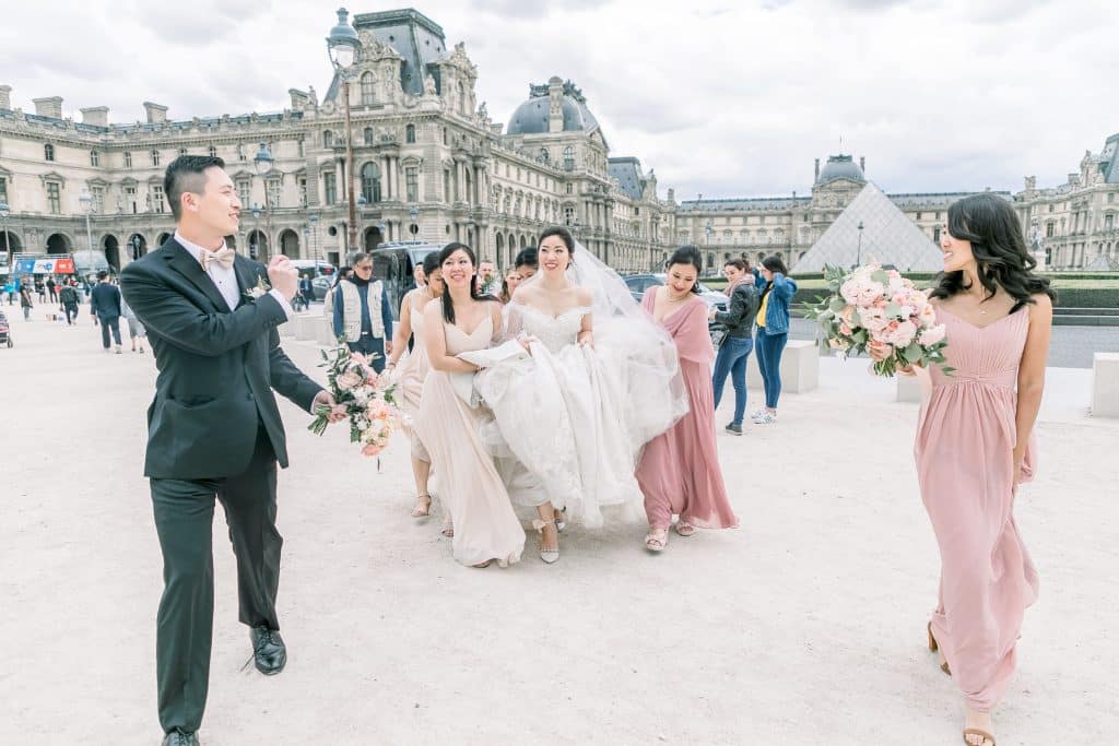 Bride and her bridesmaid in front of the louvre
